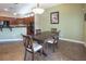 Dining area with a dark wooden table set adjacent to the kitchen area at 9077 Creed Mountain Pl, Las Vegas, NV 89178