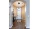 Inviting entryway with tiled floor, decorative medallion, and chandelier at 9077 Creed Mountain Pl, Las Vegas, NV 89178