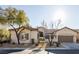 Charming single-story home featuring a tile roof and drought-tolerant landscaping at 9077 Creed Mountain Pl, Las Vegas, NV 89178