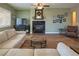 Cozy living room with fireplace, neutral decor, and comfortable seating at 9077 Creed Mountain Pl, Las Vegas, NV 89178