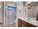 Bathroom showcases a modern vanity with a walk-in shower with glass enclosure at 917 Pomander Point Pl, Henderson, NV 89012