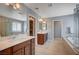 Lovely bathroom with dual sinks, a soaking tub, and a separate glass shower at 917 Pomander Point Pl, Henderson, NV 89012