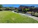 Scenic view of a well-maintained community park with lush green grass and walking paths at 917 Pomander Point Pl, Henderson, NV 89012