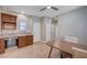 Cozy dining area with hardwood floors, mini-bar, granite countertop, and modern ceiling fan for a delightful meal at 917 Pomander Point Pl, Henderson, NV 89012