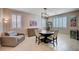 Cozy dining area featuring neutral paint, tile floors, and modern chandelier at 917 Pomander Point Pl, Henderson, NV 89012