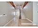Inviting entryway features wood-look tile flooring and a staircase leading to the second level of the home at 917 Pomander Point Pl, Henderson, NV 89012