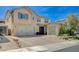 Inviting two-story home with a three-car garage and well-manicured landscaping at 917 Pomander Point Pl, Henderson, NV 89012