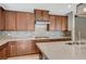 Modern kitchen featuring quartz countertops, tile backsplash, and stainless steel appliances at 917 Pomander Point Pl, Henderson, NV 89012