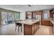 Spacious kitchen with large center island, stainless appliances, and access to outdoor living space at 917 Pomander Point Pl, Henderson, NV 89012