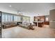 Open concept living and dining area with tile floors, recessed lights and patio access at 917 Pomander Point Pl, Henderson, NV 89012