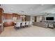 Open-concept kitchen and living area with tile floors and stainless steel appliances at 917 Pomander Point Pl, Henderson, NV 89012