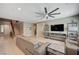 Bright and airy living room featuring tile floors, recessed lighting, and large windows at 917 Pomander Point Pl, Henderson, NV 89012