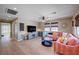 Comfortable living room with a ceiling fan, hardwood floors, and a view of the backyard at 917 Pomander Point Pl, Henderson, NV 89012