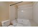 Bathroom featuring a tiled shower-tub combo and modern fixtures at 9325 W Desert Inn Rd # 143, Las Vegas, NV 89117