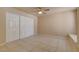 Spacious bedroom with a ceiling fan and a large closet for ample storage at 9325 W Desert Inn Rd # 143, Las Vegas, NV 89117