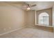 Bedroom with tiled floors and a window seat near the arched window at 9325 W Desert Inn Rd # 143, Las Vegas, NV 89117