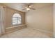 Neutral bedroom featuring a ceiling fan and a window with a built-in seat at 9325 W Desert Inn Rd # 143, Las Vegas, NV 89117