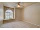 Neutral bedroom featuring a ceiling fan and a window with a built-in seat at 9325 W Desert Inn Rd # 143, Las Vegas, NV 89117
