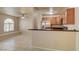 Partial view of a kitchen overlooking the living room with stainless steel appliances at 9325 W Desert Inn Rd # 143, Las Vegas, NV 89117