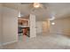 Open-concept living room with a glimpse of the kitchen and tiled floors at 9325 W Desert Inn Rd # 143, Las Vegas, NV 89117
