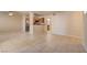 Bright, open-concept living area with neutral tile flooring, adjoining kitchen, and natural light at 9325 W Desert Inn Rd # 143, Las Vegas, NV 89117