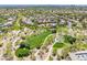 This aerial view highlights a lush park with walking paths, green spaces, and mature trees within the residential community at 9445 Grand Mesa Dr, Las Vegas, NV 89134