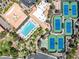 Aerial view of the community pool, tennis courts, and manicured lawns, offering ample amenities for active living at 9445 Grand Mesa Dr, Las Vegas, NV 89134