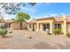 Expansive backyard with desert landscaping, a covered patio, and privacy for outdoor enjoyment at 9445 Grand Mesa Dr, Las Vegas, NV 89134