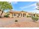 Large backyard featuring low-maintenance desert landscaping, covered patios, and distant views at 9445 Grand Mesa Dr, Las Vegas, NV 89134