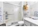 Clean bathroom featuring a glass shower, toilet and modern vanity at 9445 Grand Mesa Dr, Las Vegas, NV 89134