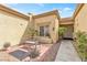 Inviting front courtyard featuring desert landscaping, a bench, and a charming front entrance at 9445 Grand Mesa Dr, Las Vegas, NV 89134