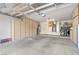 Spacious garage with ample storage cabinets, laundry area, and room for multiple vehicles at 9445 Grand Mesa Dr, Las Vegas, NV 89134