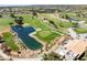 Scenic aerial of the community golf course, featuring a tranquil pond and lush green fairways, perfect for leisure and sport at 9445 Grand Mesa Dr, Las Vegas, NV 89134