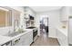 Open kitchen with quartz countertops, stainless steel appliances, and views to the dining room at 9445 Grand Mesa Dr, Las Vegas, NV 89134