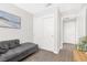 Clean living room with comfortable seating and closet space at 9445 Grand Mesa Dr, Las Vegas, NV 89134