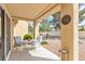 Cozy covered patio featuring comfortable seating and views of the serene desert landscaping at 9445 Grand Mesa Dr, Las Vegas, NV 89134
