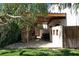 Large patio area with a beautiful stone fireplace and an outdoor table set at 9921 Heffner Hills Cir, Las Vegas, NV 89117