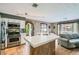 Bright, open kitchen features a large island, stainless steel appliances, and seamless flow to living area at 9921 Heffner Hills Cir, Las Vegas, NV 89117