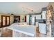 Modern kitchen featuring a large island with a quartz countertop, stainless steel appliances, and an elegant stone archway at 9921 Heffner Hills Cir, Las Vegas, NV 89117