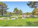 Well-maintained community pond with stone edging, small waterfalls, and plenty of green space at 9921 Heffner Hills Cir, Las Vegas, NV 89117
