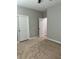 Bedroom view shows closet doors, neutral walls, and neutral carpet at 1040 Karen Ct, Pahrump, NV 89048