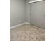 This bedroom features a closet with sliding doors and neutral carpet at 1040 Karen Ct, Pahrump, NV 89048