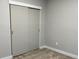 Bedroom view showcasing closet with sliding doors, neutral walls and carpet at 1040 Karen Ct, Pahrump, NV 89048
