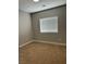 Bedroom with neutral carpet and natural light from the window at 1040 Karen Ct, Pahrump, NV 89048