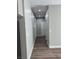 Hallway featuring wood floors, neutral walls, and modern lighting fixtures at 1040 Karen Ct, Pahrump, NV 89048