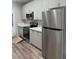 Modern kitchen with stainless steel appliances and gray cabinetry at 1040 Karen Ct, Pahrump, NV 89048