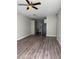 Open-concept space with wood flooring and modern gray walls at 1040 Karen Ct, Pahrump, NV 89048