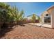 Large, private backyard featuring a wooden pergola, patio, and mature trees for shade at 10404 Shadowland Ave, Las Vegas, NV 89144