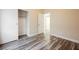This bedroom features wood-look flooring and a closet, providing space and style at 10404 Shadowland Ave, Las Vegas, NV 89144