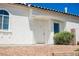 Bright and welcoming front entrance with a classic white door and desert landscaping at 10404 Shadowland Ave, Las Vegas, NV 89144